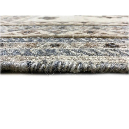 Carpet pile in close-up: thick, mixed fiber texture in light beige and blue-gray