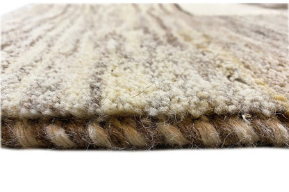 Close-up of the carpet pile: soft, short fibers with darker and beige tones