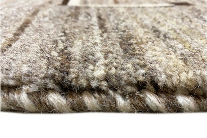 Carpet detail: short pile along the edge, gray-beige with dark accents