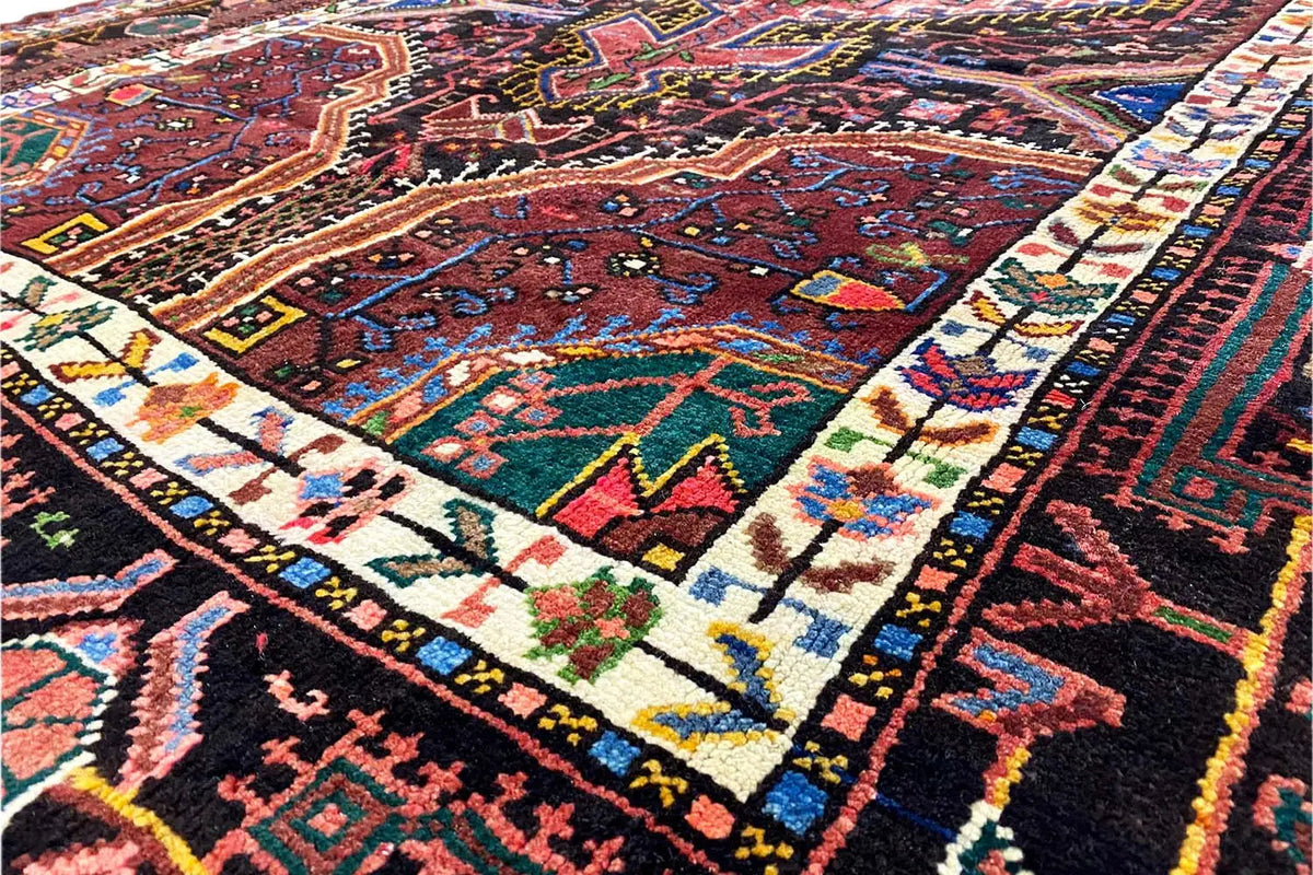 Rug detail: colorful ornaments with line and cross patterns in red, blue, and green