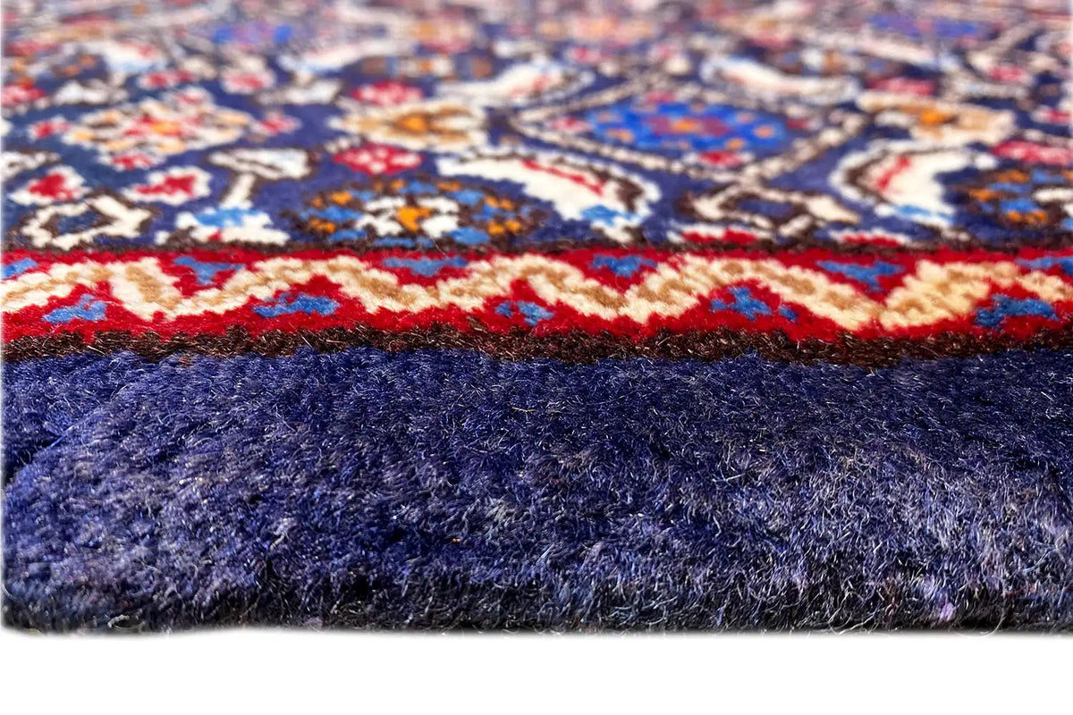 Moud rug close-up of the border with fringe and blue pile