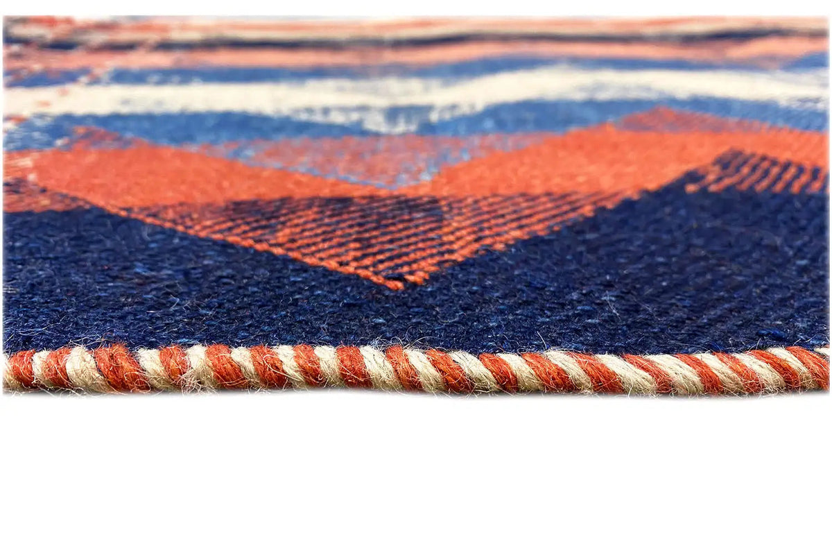 Rug edge with fringe trim, blue and orange zigzag pattern