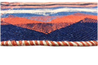 Rug edge with fringe trim, blue and orange zigzag pattern