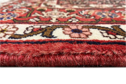 Hamadan rug: fringes and pile cut, accented in red