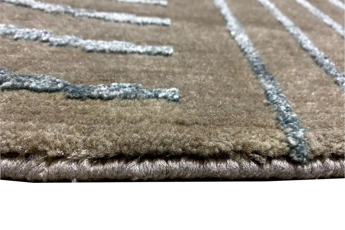 Rug border with dense pile and turquoise lines on a beige background