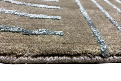 Rug border with dense pile and turquoise lines on a beige background