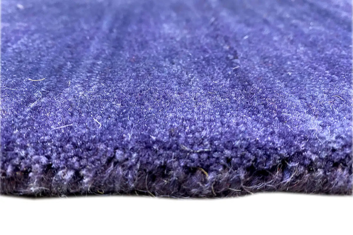 Gabbeh rug 180x123 cm: Detail of the pile surface in blue-violet