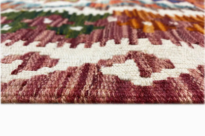 Afghan kilim (148x95 cm) Detail of the weave structure: reddish-brown pattern on a light background