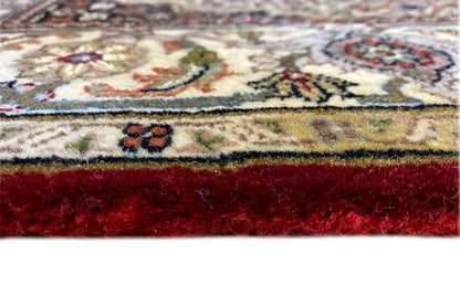 Indo Täbriz rug (145x76 cm) Detail of the edge with fringe and red pile background