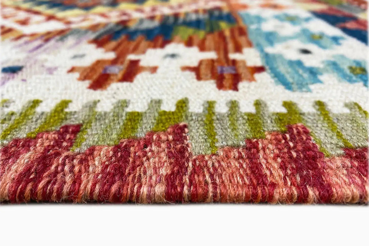 Close-up: colorful kilim runner with a dense pile and multicolored embroidered/woven patterns