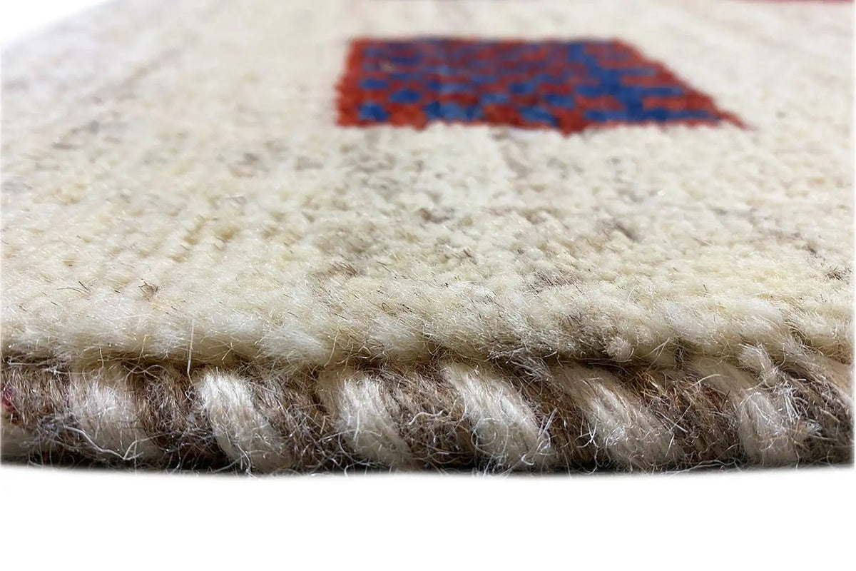 Gabbeh rug 297x202 cm, pile detail: beige background with blue motif