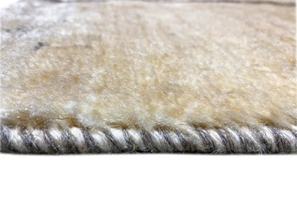 Gabbeh Lori rug edge with dense fringes in gray and beige
