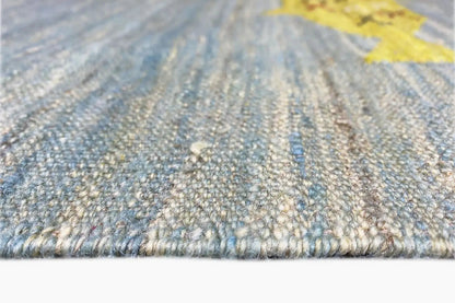 Close-up of the kilim weave with multicolored fish motifs along the edge