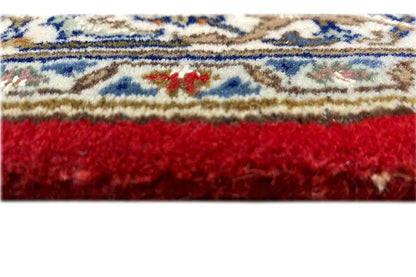 Bidjar runner with a red border and woven edging, fringed finish on the sides