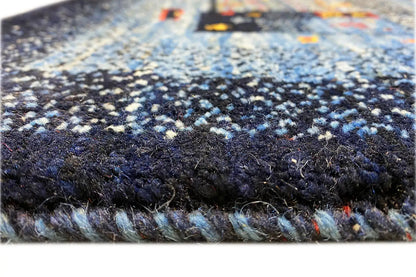 Gabbeh rug: detailed pile texture with dense, dark blue and light fibers