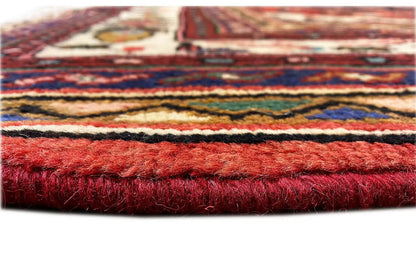 Rug edge with dense pile, red-dyed hem, and multicolored stripes