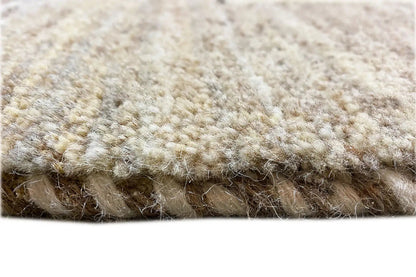 Gabbeh rug: dense pile in beige and brownish-gray tones, close-up of the edge