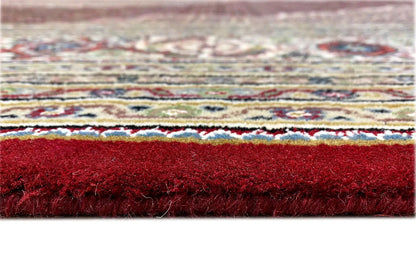 Carpet edge with short pile and fringes, edged in red, side detail view