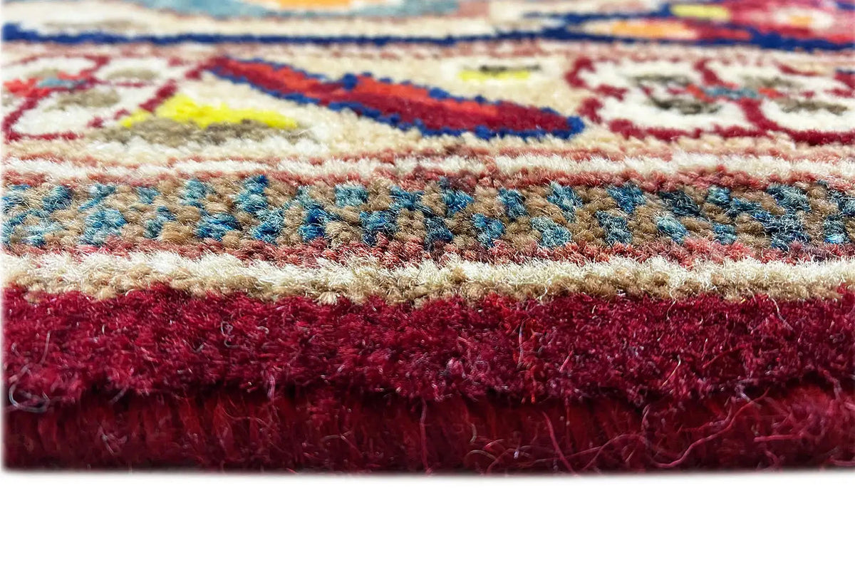 Bakhtiari rug with a visible pile surface and short fringes along the edge