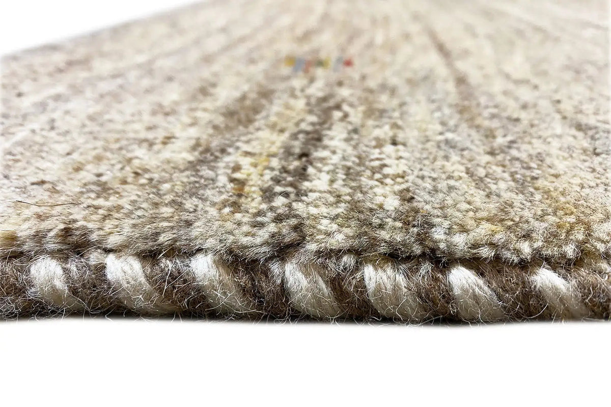 Gabbeh rug edge with fringed trim, beige and brown pile