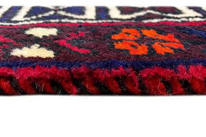 Sirjan rug with fringe, burgundy pile, and orange pattern