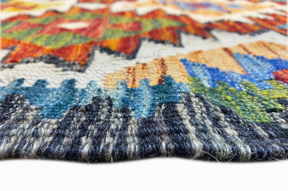 Kelim runner with a visible pile texture and colorful motifs along the edge