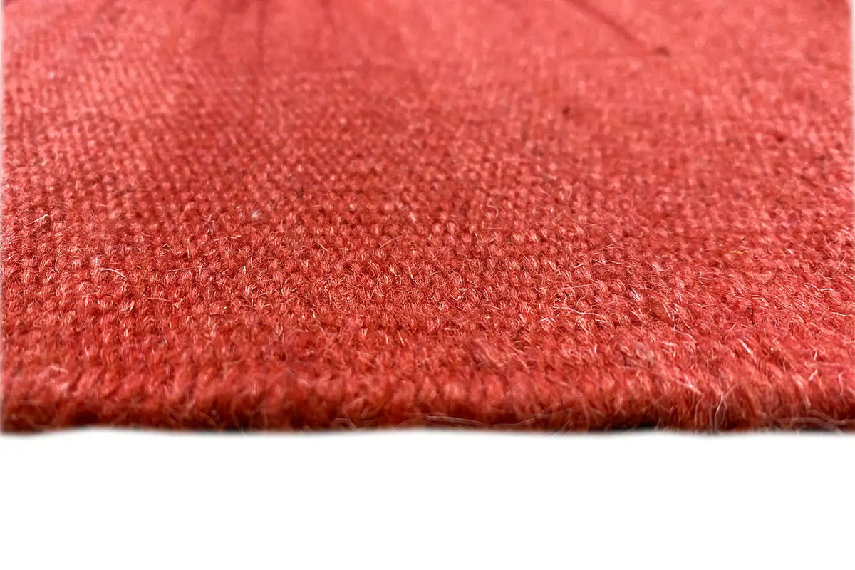 Red carpet with a dense, mottled pile surface