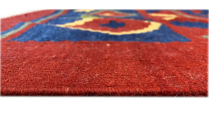 Kilim rug with red pile and a colorful ornamental design