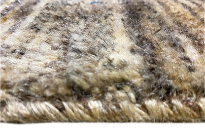 Close-up: beige Gabbeh rug pile with blue and red threads and a patterned texture