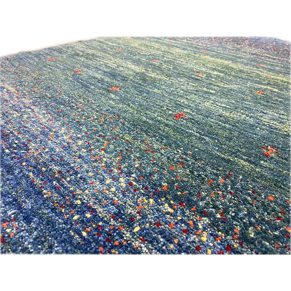 Gabbeh rug 91x63 cm detail view: textured pile in green-blue/dark blue with dots