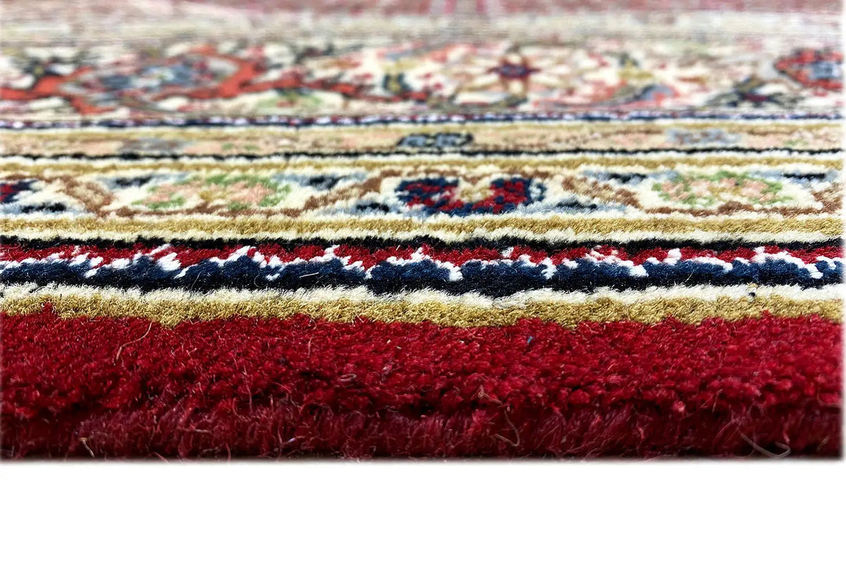 Indo Tabriz rug finishing edge with multicolored border and fringe