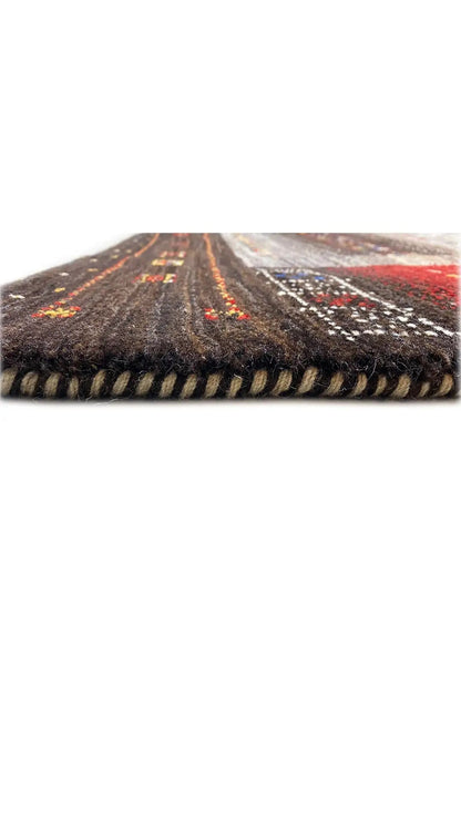 Rug edge with a multicolored pattern and black fringed finish