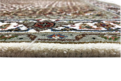 Tabriz carpet detail: pile surface and fringe, close-up of the carpet edge
