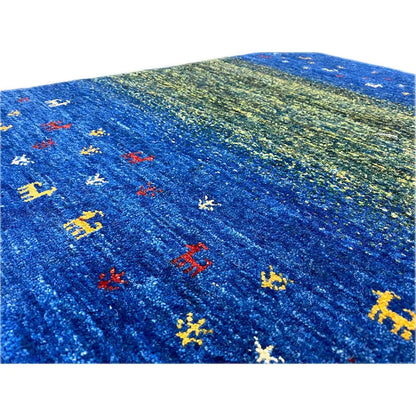Close-up: blue-green Gabbeh with colorful animal patterns