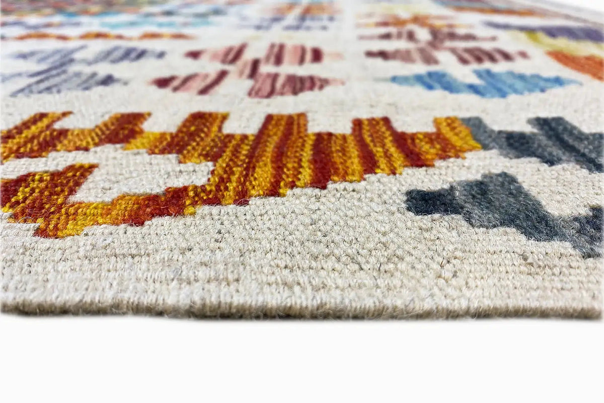 Afghan kilim rug, close-up with textured pile and colorful motifs