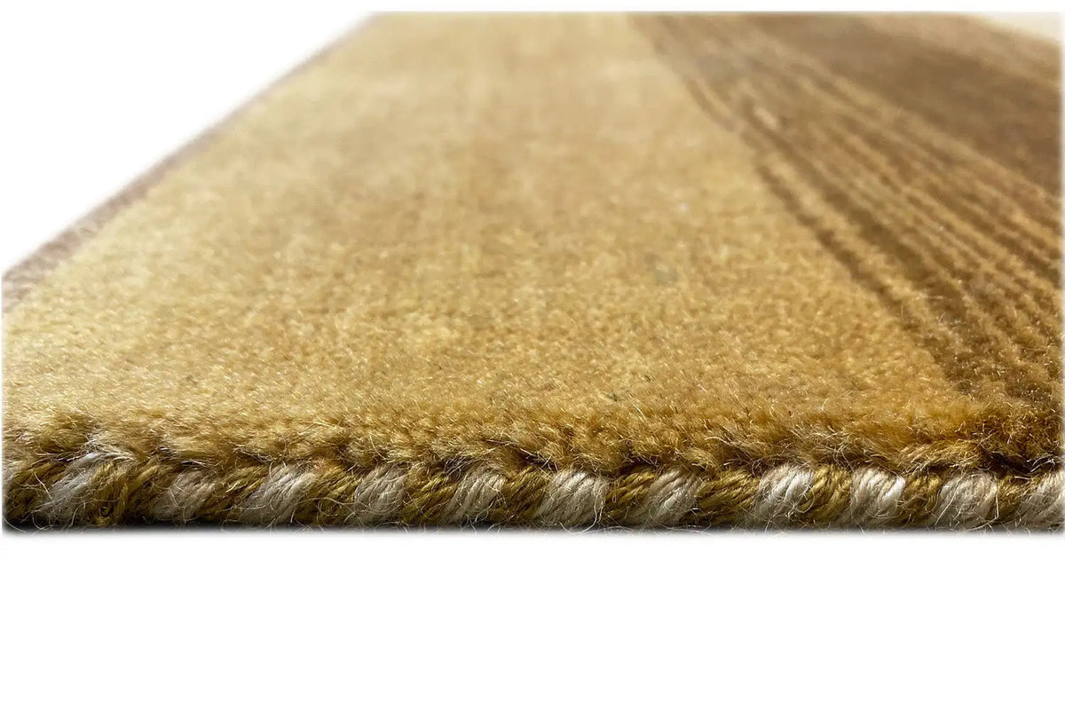 Carpet edge with soft pile and brown edging, beige background