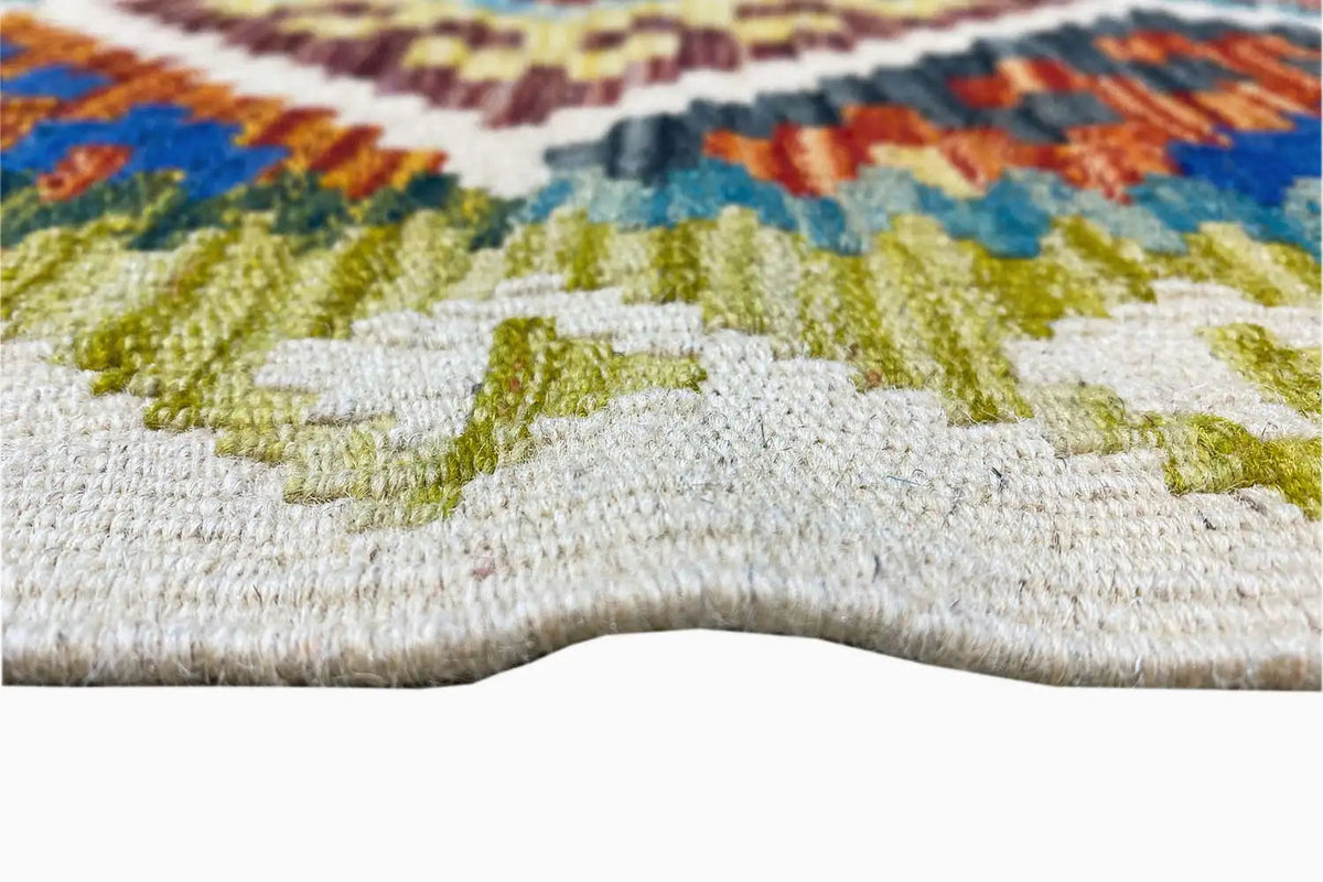Close-up: woven texture of a multicolored pattern on a light background with relief