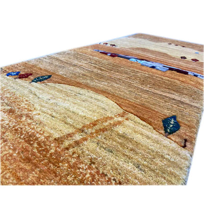 Gabbeh rug (runner) close-up: textured wool with brown-beige areas and a blue border