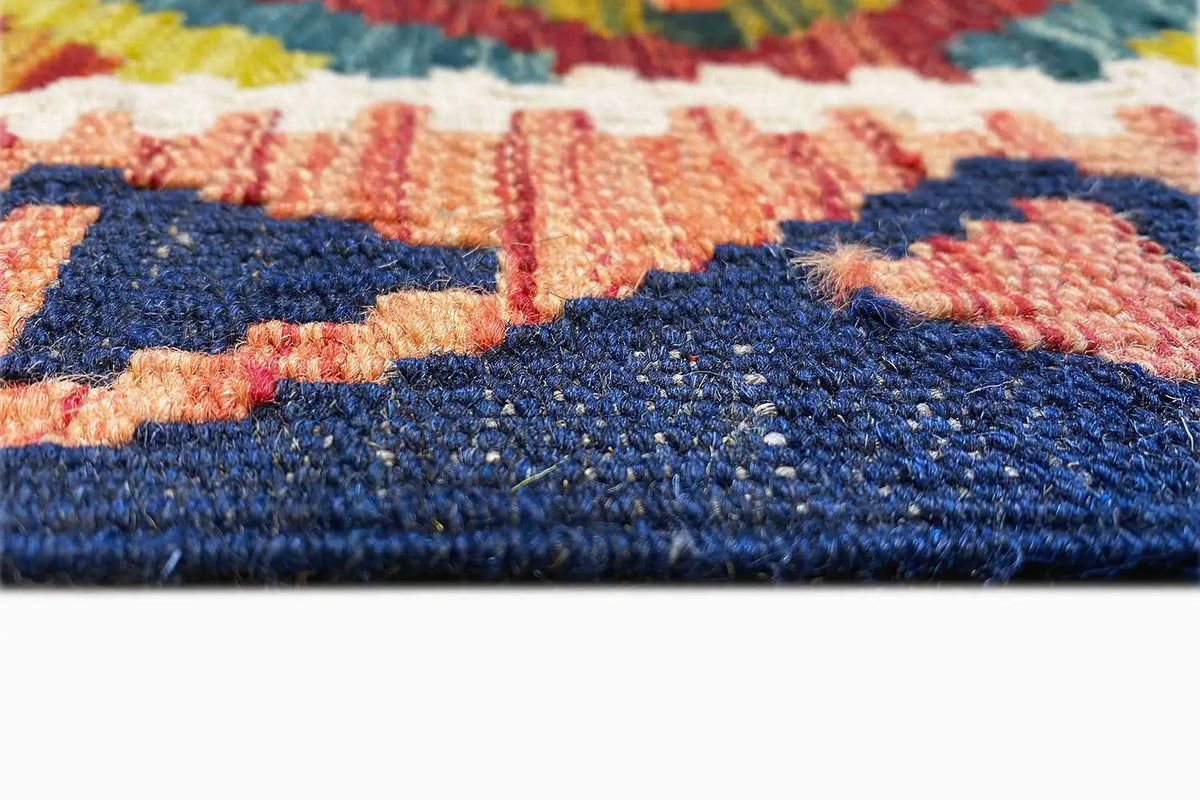 Kelim Afghan runner: close-up of the weave structure and colorful border in shades of blue and red