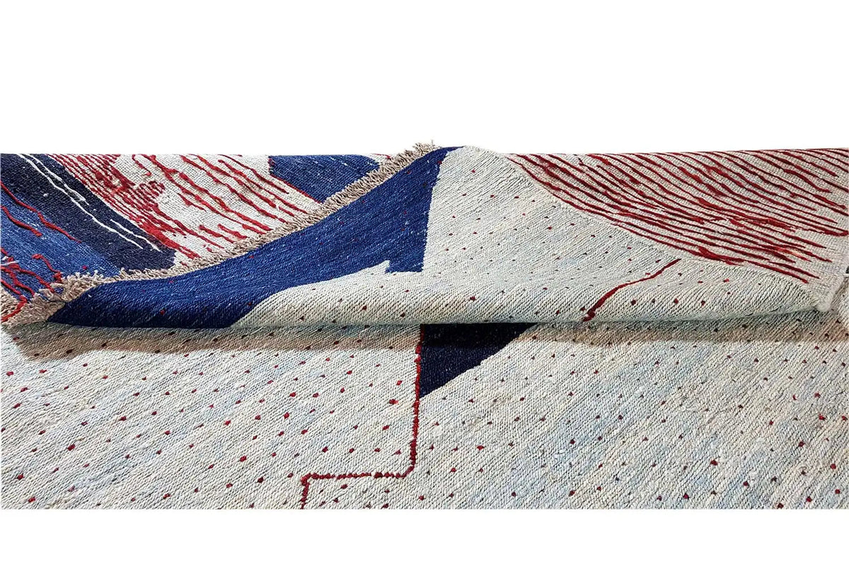Kilim rug detail with dots, red lines, and blue areas