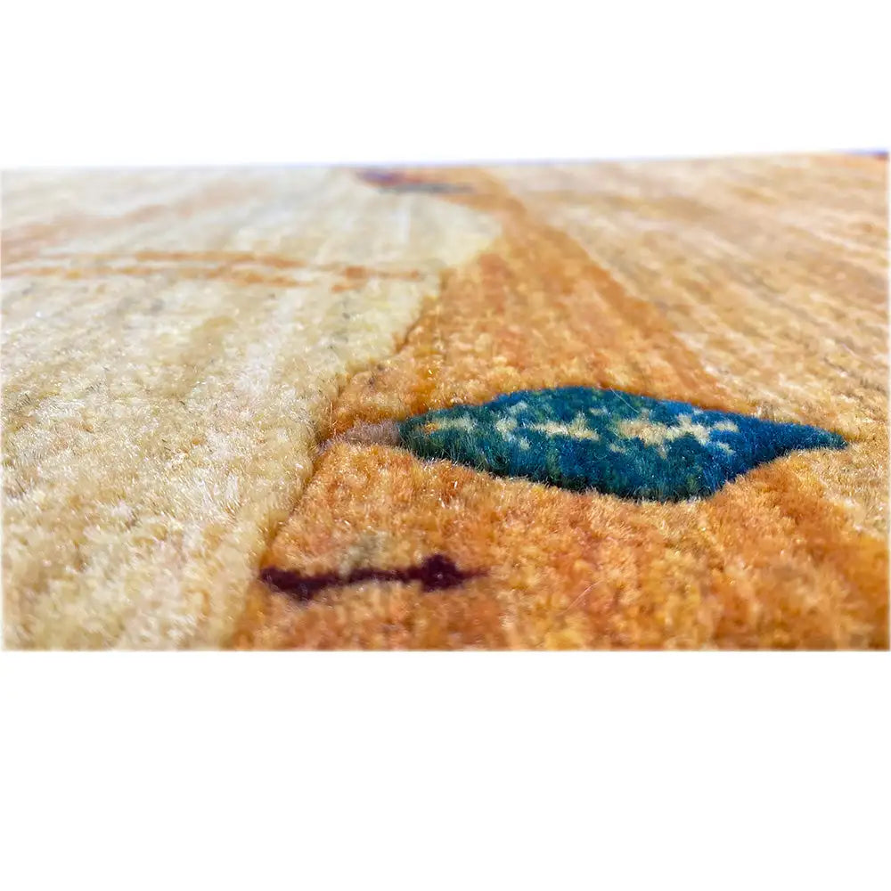 Gabbeh rug (runner) close-up: pile texture and a blue motif in the pattern