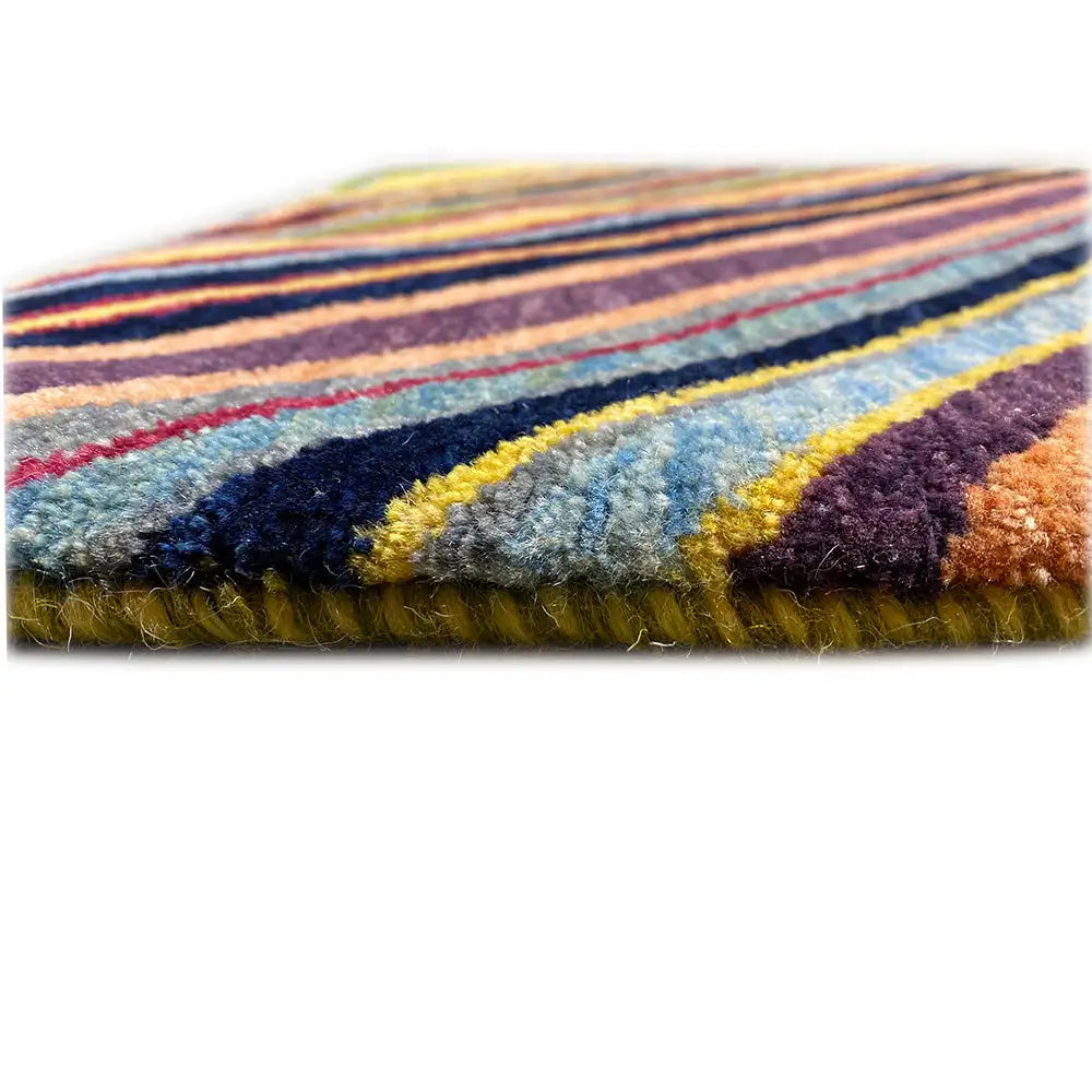 Gabbeh rug: detail of the rug edge and multicolored fringe