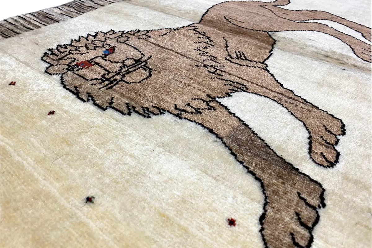 Gabbeh rug with lion's head motif, beige field, brown design, detail