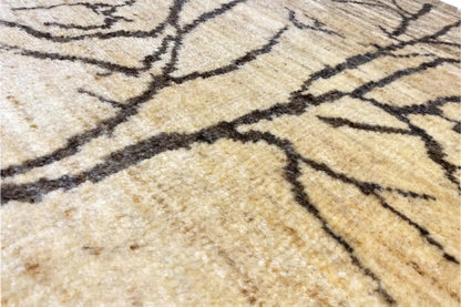 Close-up: beige Gabbeh Lori rug with dark lines and a dense woven texture