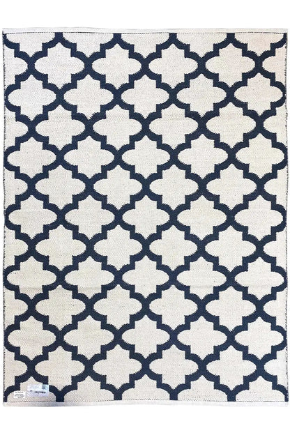 Rectangular kilim rug with a dark blue background and white geometric pattern
