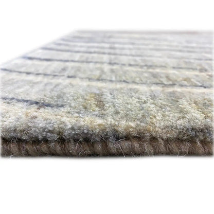 Back view of a Gabbeh rug with a beige pile and dark blue lines; edges with fringes