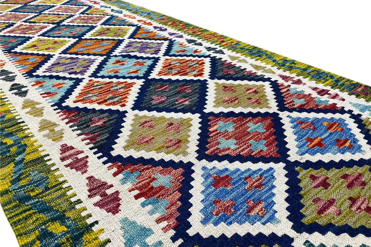 Kilim runner detail with colorful diamonds and a dense weave structure