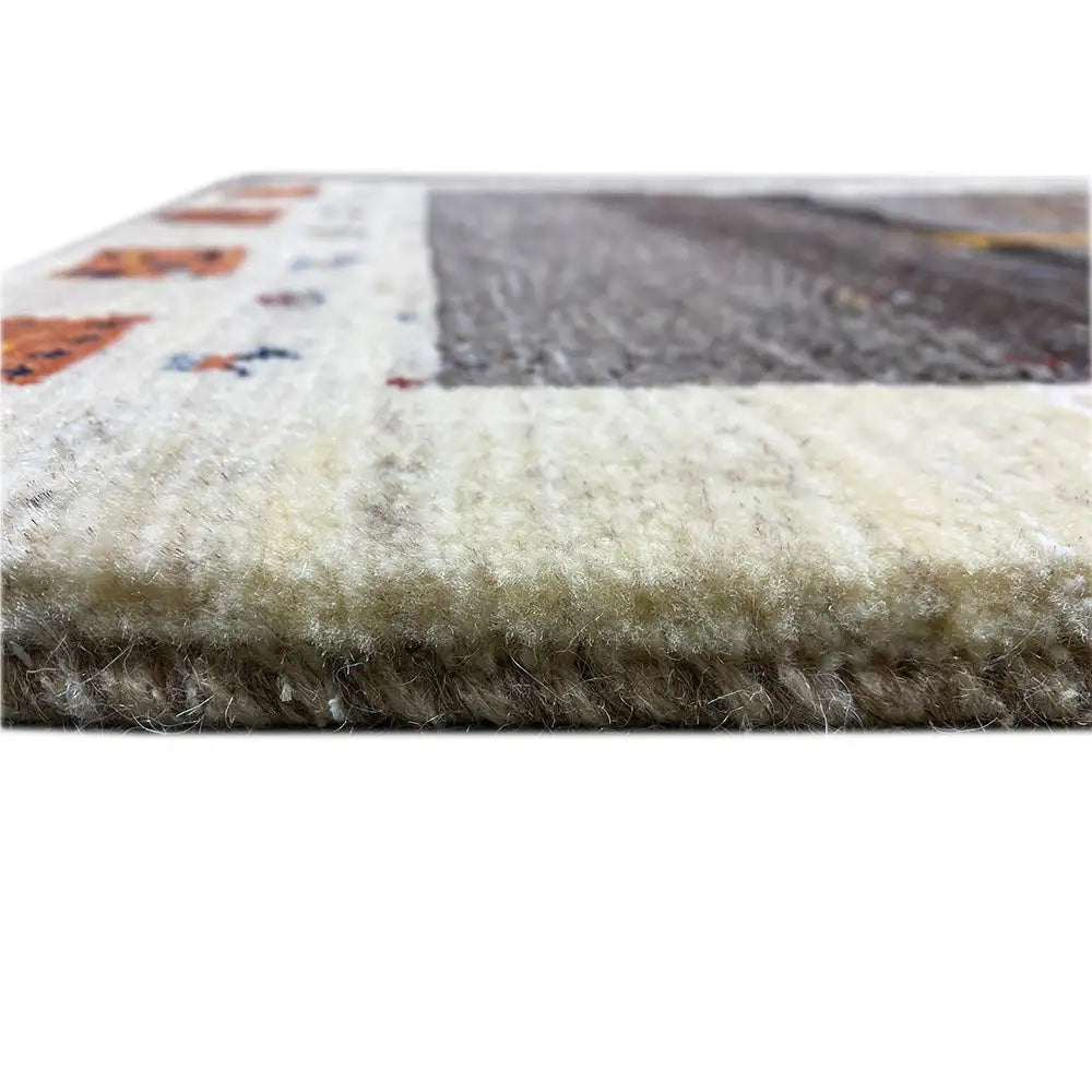 Lori Gabbeh rug: side view with short pile and a light wool edge along the border