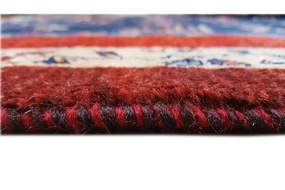 Carpet edge in detail: dense pile, red stripe, and short fringe