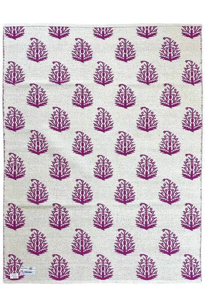 Rug with a beige background and violet and white tree ornaments, square